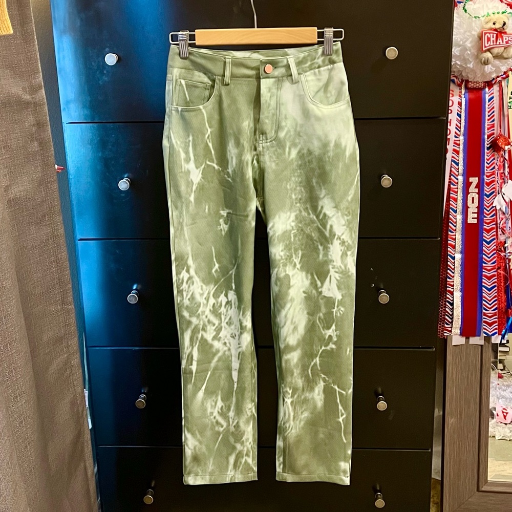 Green patterned pants. The brand is called Yvonne & Love.